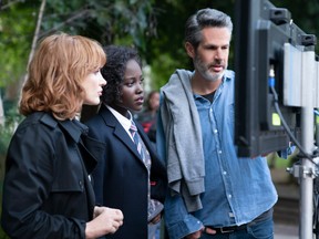 Jessica Chastain with Lupita Nyong'o and director Simon Kinberg on the set of The 355.