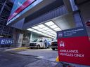A paramedic returns to their ambulance outside the emergency department at Mount Sinai Hospital in Toronto, Ontario, on January 5, 2022. (Photo by Geoff Robins / AFP) 