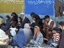 Hundreds of people gather near an evacuation control checkpoint outside the Hamid Karzai International Airport in Kabul last August.