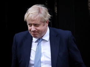 British Prime Minister Boris Johnson walks outside 10 Downing Street in London on Monday after the report was released.