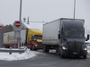 Trucks arrive from the U.S. at the border in St-Bernard-de-Lacolle, Quebec, Canada, on Friday, Jan. 14, 2021. Trucker shortages that are now being exacerbated by vaccine mandates at the border are already leading to bare produce shelves.