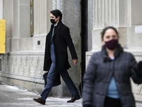 Prime Minister Justin Trudeau leaves after speaking at a news conference on the COVID-19 pandemic in Ottawa, on Wednesday, Jan. 5, 2022.