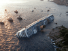 An aerial view taken on January 14, 2012 shows the Costa Concordia, after the cruise ship ran aground and keeled over off the Isola del Giglio, on late January 13.