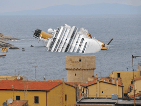View of the wrecked cruise liner Costa Concordia on January 16, 2012,  in the harbour of the Tuscan island of Giglio after it ran aground after hitting underwater rocks on January 13.