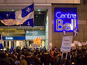 Demonstrators gather outside the Bell Centre in Montreal to protest the unilingual English-speaking interim head coach of the Montreal Canadiens, Randy Cunneyworth, in 2012.