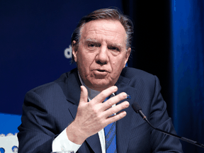 Quebec Premier Francois Legault responds to a question during a news conference in Montreal, Jan. 11, 2022.