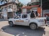 Armed police patrol in a truck after the streets of the Haitian capital Port-au-Prince were deserted following a call for a general strike to denounce violence in the city, October 18, 2021.
