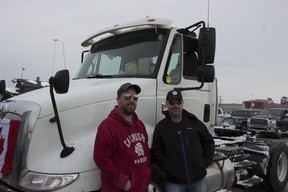 James Smockum (right) a truck driver for the film industry at the convoy takeoff event in Vaughan. Credit: Rachel Parent/National Post