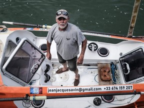 This file photo taken on May 28, 2021 shows Jean-Jacques Savin, a former paratrooper, posing on his rowboat at a shipyard in Lege-Cap-Ferret, southwestern France. Savin, who set off in a rowboat from Portugal on Jan. 1 to cross the Atlantic solo, has vanished at sea.