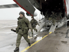 Russian soldiers disembark from a military aircraft at an airfield in Kazakhstan, January 7, 2022.