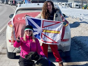 Lola Parsons (left) and Jennifer Whiteway pose with Monty the dog at a pitstop in Aulac, New Brunswick, on their way to Ottawa. Photo provided by Lola Parsons.