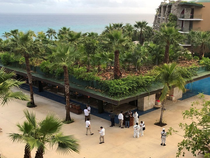  Forensic technicians and hotel employees stand near a scene where three Canadian citizens were hit by gunshots at Hotel Xcaret, in Playa del Carmen, Mexico January 21, 2022.