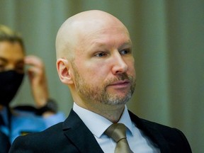 Anders Behring Breivik (R) is pictured on the first day of the trial where he is requesting release on parole, on January 18, 2022 at a makeshift courtroom in Skien prison, Norway