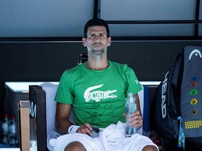 Novak Djokovic of Serbia takes part in a practice session ahead of the Australian Open tennis tournament in Melbourne on Jan. 13, 2022. Although Djokovic won his initial legal battle to enter Australia for the Open, it's not known if he will be allowed to stay.