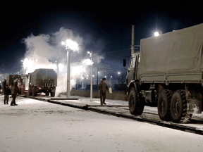 A Russian military vehicle drives on a railway platform before transferring to attend a joint military drills in Belarus, which shares a border with Ukraine, Jan. 24, 2022.