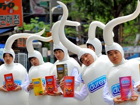 'Sperm men' distribute Durex condom samples during a campaign in Seoul in 2008.
