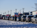 The Freedom Convoy 2022 is cheered on by supporters parked west of Winnipeg in this Tuesday photo. 