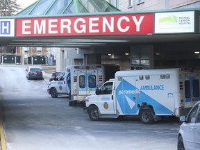Toronto EMS sit in the emergency entrance at East York's Michael Garron Hospital.
