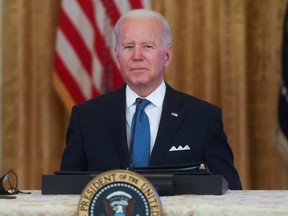 President Biden listens to a question from Fox News reporter Peter Doocy on Monday night.