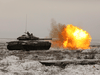 A Russian tank T-72B3 fires as troops take part in drills at the Kadamovskiy firing range in the Rostov region in southern Russia, Jan. 12, 2022.