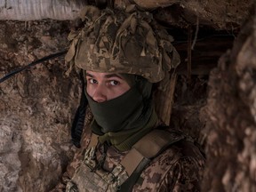 A Ukrainian soldier stands in a trench near the front line with Russia on Jan. 17, 2022, in the village of New York, formerly known as Novhorodske. Diplomatic talks with Russia on the Ukrainian crisis ended last week without a resolution.
