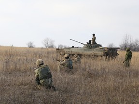 In this 2015 photo, Ukrainian soldiers conduct platoon level operations under Canadian supervision at Starychi, Ukraine.