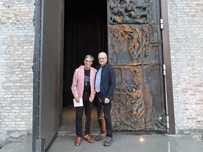 Dr. Josh Josephson and Howard Levitt stand in front of the massive bronze doors at Copenhagen’s Alchemist.