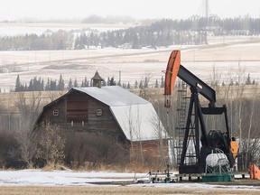 A pumpjack works just south of Cutbank Lake, near Wembley, Alta. Canada should withdraw from all international agreements on global warming, writes Rex Murphy.