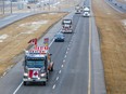 Trucks in the “freedom convoy” of truckers head east on the Trans-Canada Highway east of Calgary on Monday, January 24, 2022. The truckers are driving across Canada to Ottawa to protest the federal government’s COVID-19 vaccine mandate for cross-border truckers.
(Gavin Young/Postmedia)