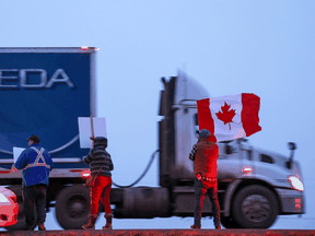 Trailers cheer on truck drivers along the Trans-Canada Highway near Calgary.