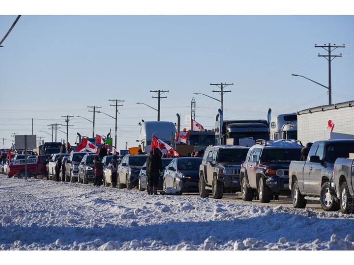  Truckers protesting a COVID-19 vaccine mandate for those crossing the Canada-U.S. border on the Trans-Canada Highway west of Winnipeg, Manitoba.