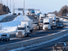 Trucks from the “Freedom” convoy travel on Highway 401 headed eastbound in Kingston, Ont., toward Ottawa, on January 28, 2022.