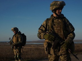 Service members of the 28th Separate Mechanized Brigade of the Ukrainian Armed Forces take part in coastal defence drills in the Odessa region, Ukraine, released January 28, 2022.