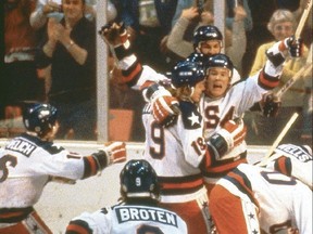 Team USA celebrates their 4-3 victory over the Soviet Union in the semi-final Men's Ice Hockey event at the Winter Olympic Games in Lake Placid, New York on February 22, 1980.