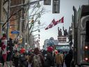 People gathered in Downtown Ottawa during the Freedom Convoy protest, Sunday, February 6, 2022. 