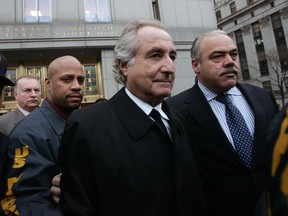 NEW YORK - JANUARY 5:  Bernard Madoff (C) walks out from Federal Court after a bail hearing in Manhattan January 5, 2009 in New York City. Madoff is accused of running a $50 billion Ponzi scheme through his investment company. Madoff is free on bail and hasnt formally responded to the charges or entered a plea.