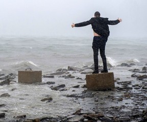 An unidentified thrill-seeker braces against the impact of Hurricane Dorian on September 2019, in Dartmouth, N.S. Census figures on Wednesday showed the Maritimes grew faster than the Prairies for the first time since the 1940s.