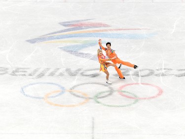 BEIJING, CHINA - FEBRUARY 04: Piper Gilles and Paul Poirier of Team Canada skate in the Ice Dance Rhythm Dance Team Event during the Beijing 2022 Winter Olympic Games at Capital Indoor Stadium on February 04, 2022 in Beijing, China.