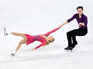 BEIJING, CHINA - FEBRUARY 04: Kirsten Moore-Towers and Michael Marinaro of Team Canada skate in the Pair Skating Short Program Team Event during the Beijing 2022 Winter Olympic Games at Capital Indoor Stadium on February 04, 2022 in Beijing, China.