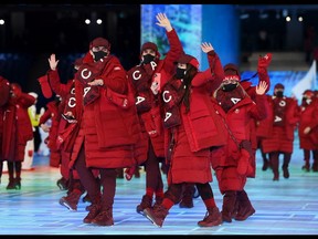 Members of Team Canada wave during the Opening Ceremony of the Beijing 2022 Winter Olympics at the Beijing National Stadium on Feb. 4, 2022 in Beijing.