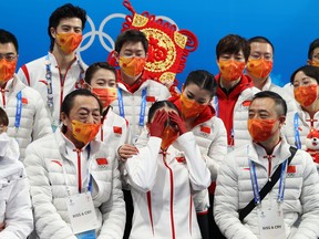Zhu Yi of Team China reacts to their score during the Women Single Skating Free Skating Team Event on day three of the Beijing 2022 Winter Olympic Games at Capital Indoor Stadium on February 07, 2022 in Beijing, China.