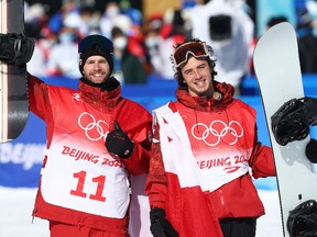 Gold medalist Max Parrot of Team Canada (L) and bronze medalist Mark McMorris of Team Canada celebrate during the Men's Snowboard Slopestyle Final on Day 3 of the Beijing 2022 Winter Olympic Games.