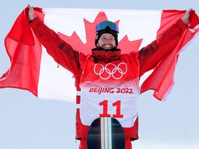 Gold medallist Max Parrot of Team Canada celebrates during the Men's Snowboard Slopestyle flower ceremony at Genting Snow Park on February 07, 2022 in Zhangjiakou, China.