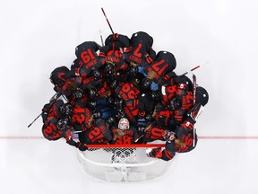 Team Canada curls up before the start of the match against Team Sweden during the women's ice hockey quarterfinal match on day 7 of the Beijing Winter Olympics 2022 at the Wukesong Sports Center on February 11, 2022 in Beijing, China.