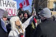 Anti vaccine mandate protesters harass  journalists on Monday, Feb. 14, 2022.