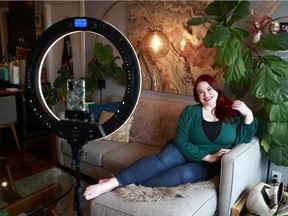 VANCOUVER, BC - JANUARY 29: Jennifer Palsenbarg, a plus-size model who makes the majority of her income from Instagram, poses in front of her camera in her home in Vancouver, January 29, 2022. Palsenbarg has a verified Instagram account with half a million followers and it was recently disabled without explanation by the social networking company.