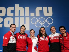 Ice Hockey Canadian Women team players (from R) Danielle Goyette, Brianne Jenner, Caroline Ouellette, Jayna Hefford, Lauriane Rougeau, and their coach kevin Dineen, pose after a press conference on February 5, 2014 in Sochi, two days ahead of the opening ceremony of the 2014 Sochi Winter Olympic games.