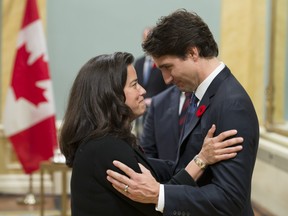 Prime Minister Justin Trudeau speaks with  Justice Minister Jody Wilson-Raybould during a swearing-in ceremony at Rideau Hall in Ottawa, in 2015.