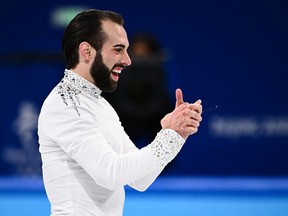 USA's Ashley Cain-Gribble (not pictured) and USA's Timothy Leduc react after competing in the pair skating short program of the figure skating event during the Beijing 2022 Winter Olympic Games at the Capital Indoor Stadium in Beijing on February 18, 2022.
