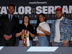Katie Taylor, centre left, and Amanda Serrano, centre right, are flanked by promoters Eddie Hearn, left, and Jake Paul at a press conference in London on Feb. 7.